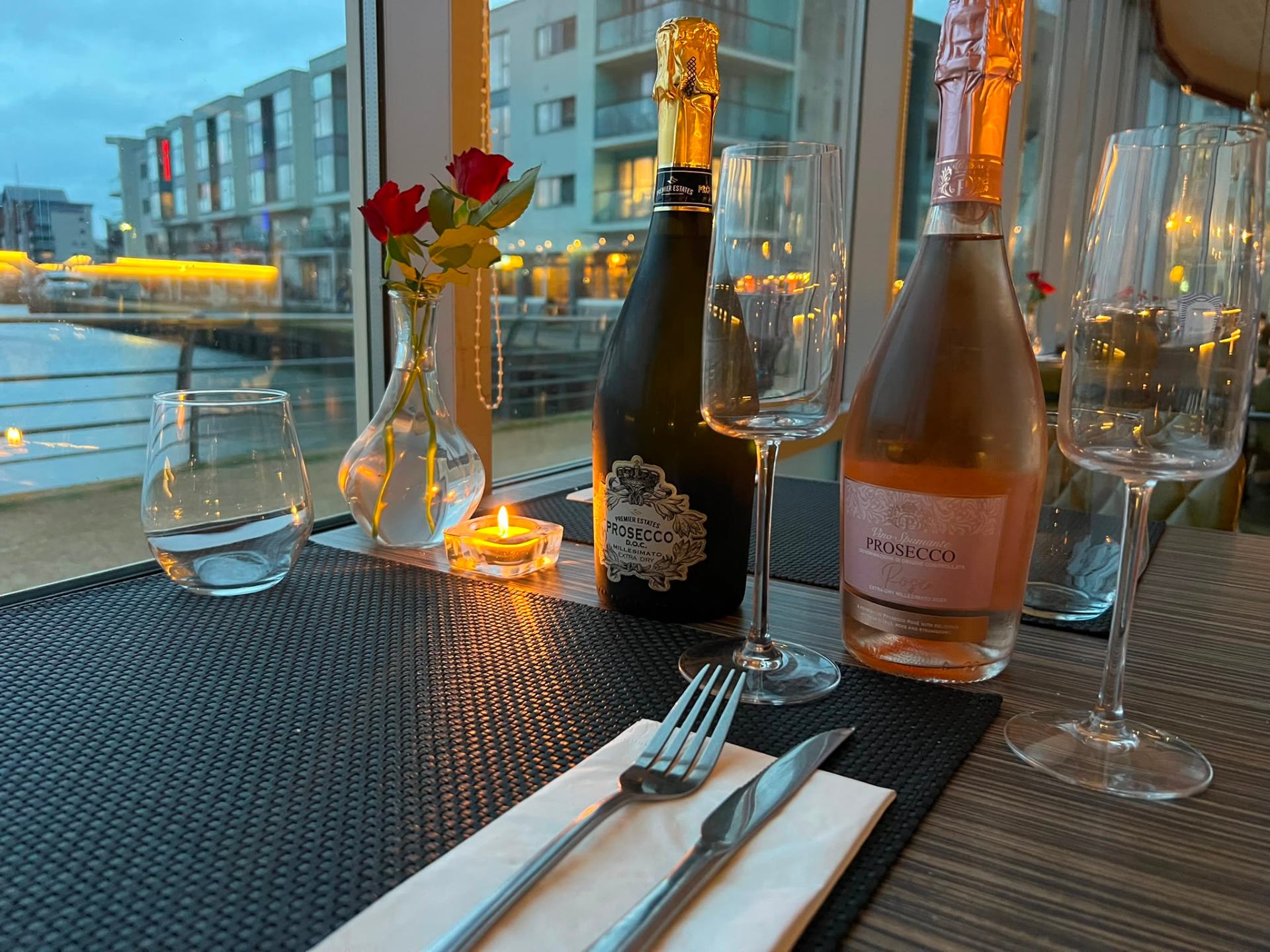 Prosecco and rosé on a candlelit table overlooking Portishead Marina