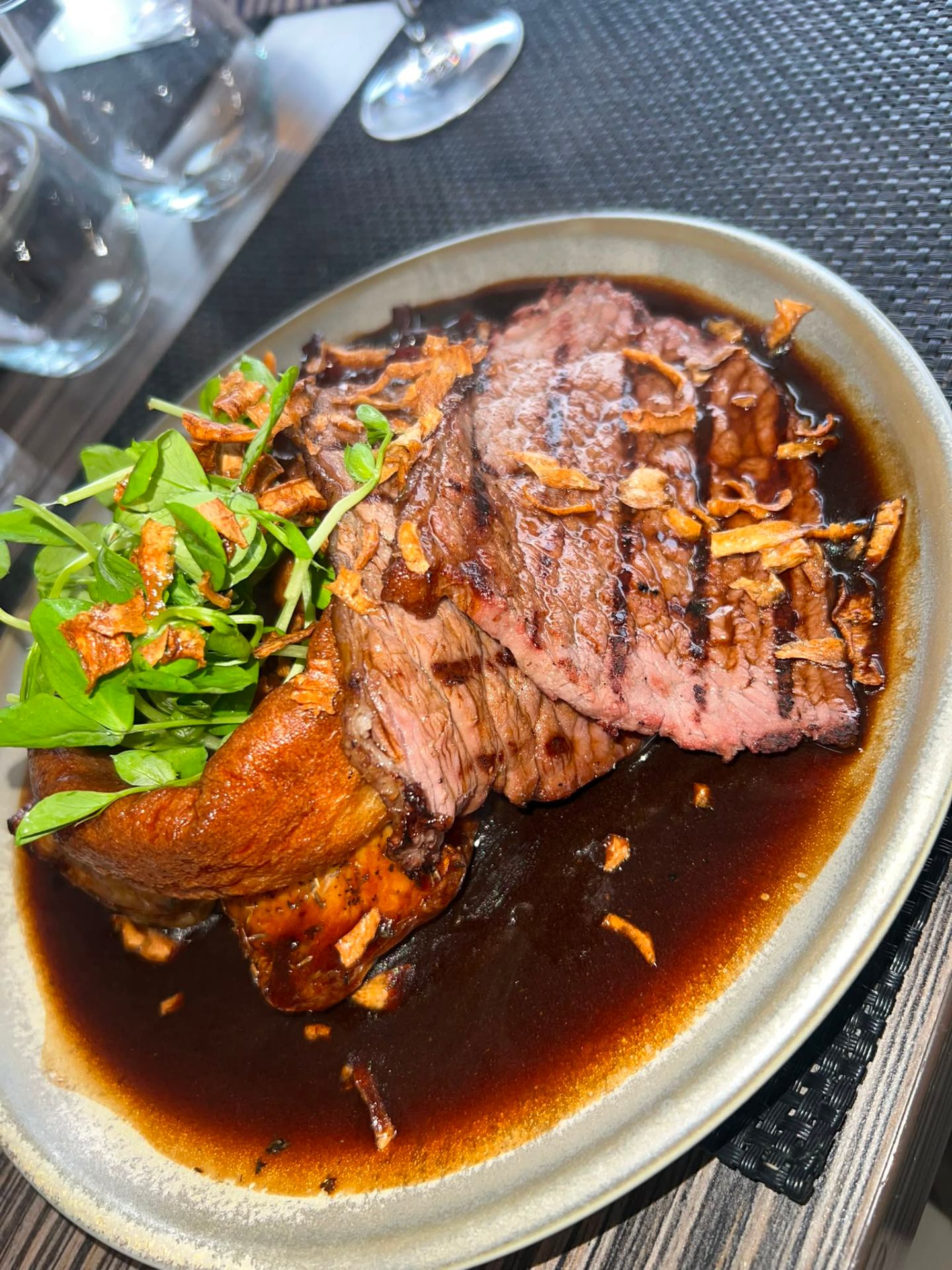 Grilled sirloin steak with crispy onions